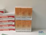 several boxes of soap sitting on top of a table next to each other