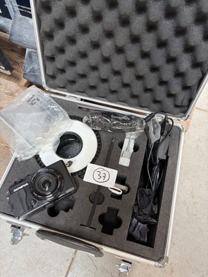 a case with a camera and a cd inside of it