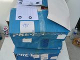 a stack of boxes sitting on top of a white table