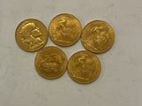 four gold sovereigns, one of which is a sovereign and one of which is a sovereign
