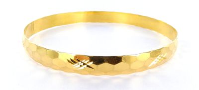 an image of a close up of a gold bracelet on a white background
