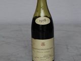 a bottle of wine that is sitting on a table
