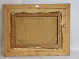 an old picture frame with a piece of wood on top of it