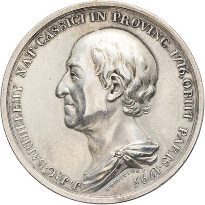 an old silver coin with a portrait of a man on it