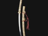 a chinese sword with carved handle and sheath
