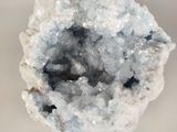 a close up of a piece of rock with crystals on it