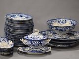 several blue and white plates and bowls are stacked on top of each other