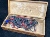 a wooden box with wires and wires in it