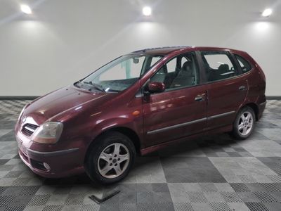 an image of a maroon car parked in a garage
