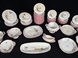 many different types of porcelain dishes and dishes on the table
