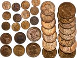 a bunch of coins sitting next to each other on top of a white surface