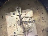 a clock that has been broken and is sitting on a table