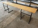 a wooden bench that is sitting in the middle of a room