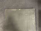 an image of a piece of metal sitting on top of a carpeted floor