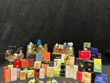 many different types of perfumes on a black background