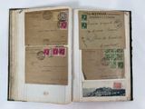 an open book with stamps and stamps on it