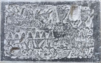 a close up of a black and white photo of a plaque