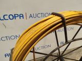 a close up of a yellow wire on a bicycle wheel