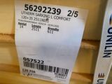 a label on the back of a box that is sitting on a shelf