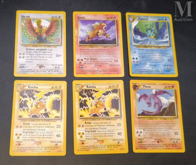 four pokemon cards sitting on top of each other on a table