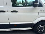 a white van parked on the side of the road