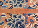 a close up of a piece of cloth with flowers on it