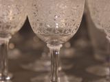 several empty wine glasses are lined up on a table