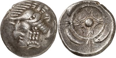 a silver coin with an image of a bird on it