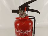 a red fire extinguisor on a white background