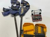 a table with tools on it that include a hammer, pliers, and a pair of pliers