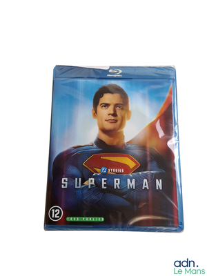 superman blu - ray movie cover with superman standing in front of a white background