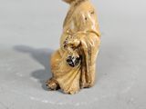 a figurine of a man with a hat on