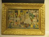 painting of a painting of a street scene in a gold frame on a white wall