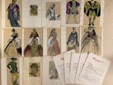 many different types of paper dolls displayed on a table