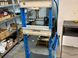 a machine that is sitting in a room with shelves