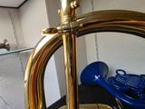a brass instrument that is sitting on a table