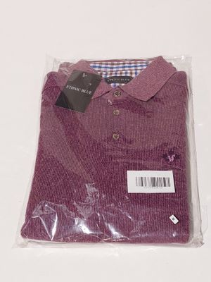 purple polo shirt in plastic bag on white background with price tag