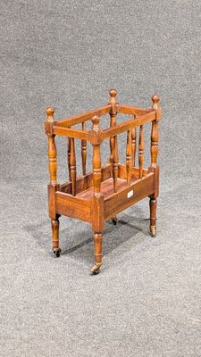 a small wooden magazine rack on the floor