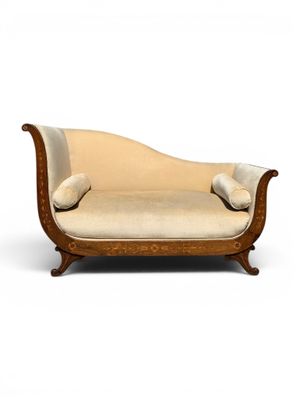 an antique style chaise lounger with beige upholstered upholstered cushions