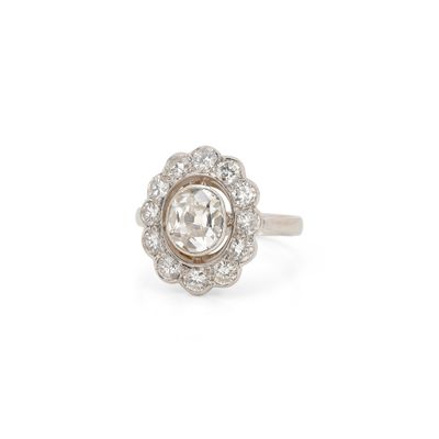 a close up of a diamond ring on a white background