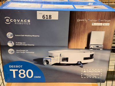 packaging of a robotic vacuum cleaner on display in a store
