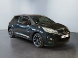 the black citrole is parked in a large room
