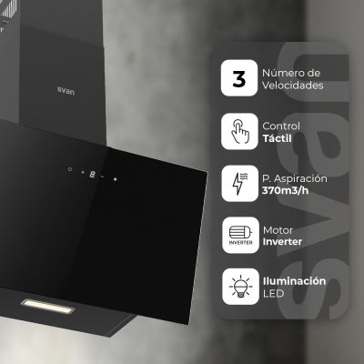 un gros plan d'un four de cuisine noir posé sur un mur blanc