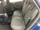 the back seats of a blue car are clean and ready to be used