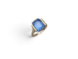 a gold ring with a blue stone in the center