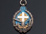 an image of a cross is on a blue and gold medal