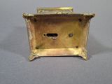 a small metal box that has a hole in it