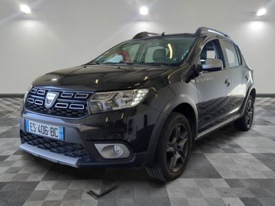 a picture of a black dacia parked on a checkered floor