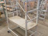 many ladders that are sitting in a warehouse