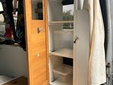 an image of the inside of a van with the door open